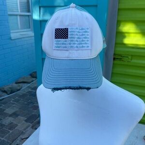 Blue and White Trucker Hat with Fish Flag Patch distressed look.